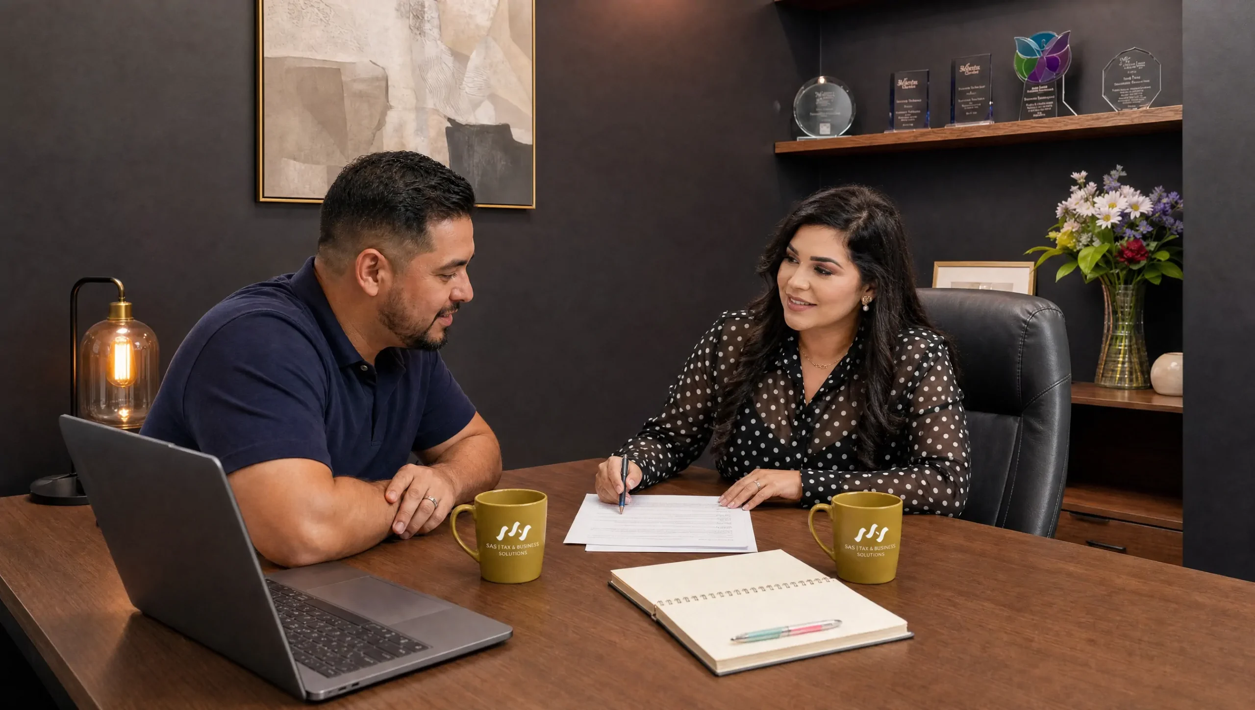 Hispanic employee in a personalized W-2 tax consultation with his SAS advisor in Houston